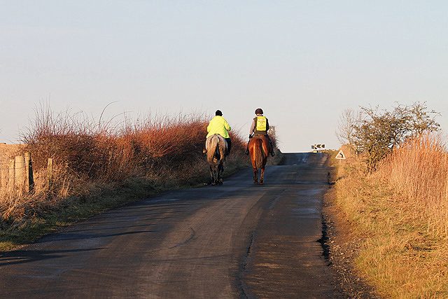 Horse riders on open moorland — photo Walter Baxter / Geograph, CC BY-SA 2.0